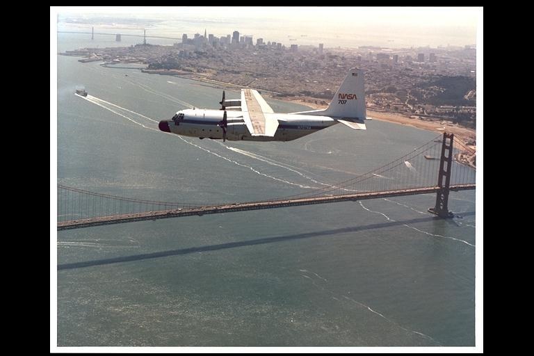 t	C130 over golden gate bridge (note ship wakes)